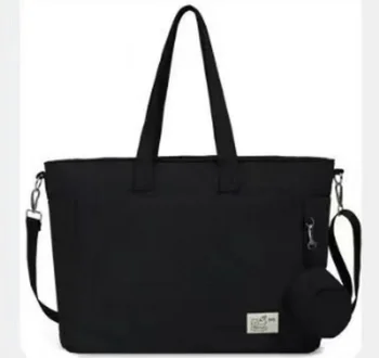 Black quilted changing bag with shoulder strap and round pouch
