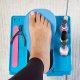 Pedicure table with adjustable footrest, fan and illuminated magnifier
