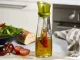 Bottle for oil vinegar glass dispenser with seasoning herbs 0.5l