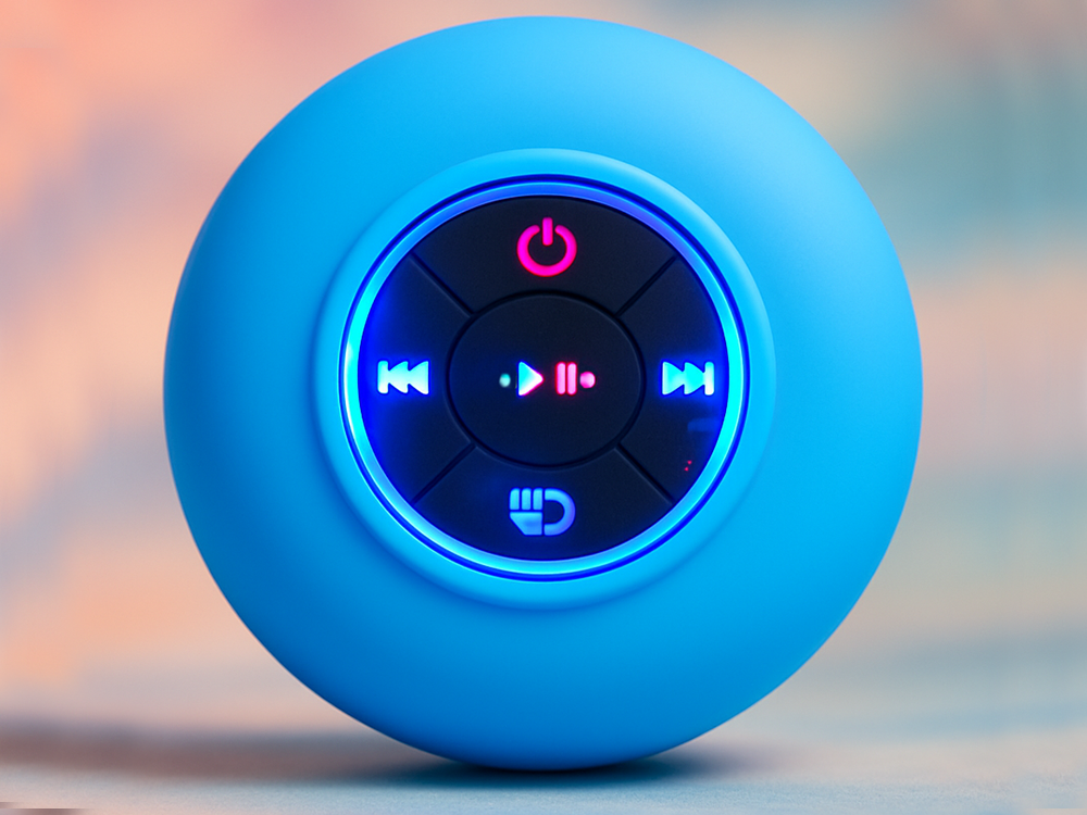 Compact wireless Bluetooth speaker IPX4 with suction cup and bass